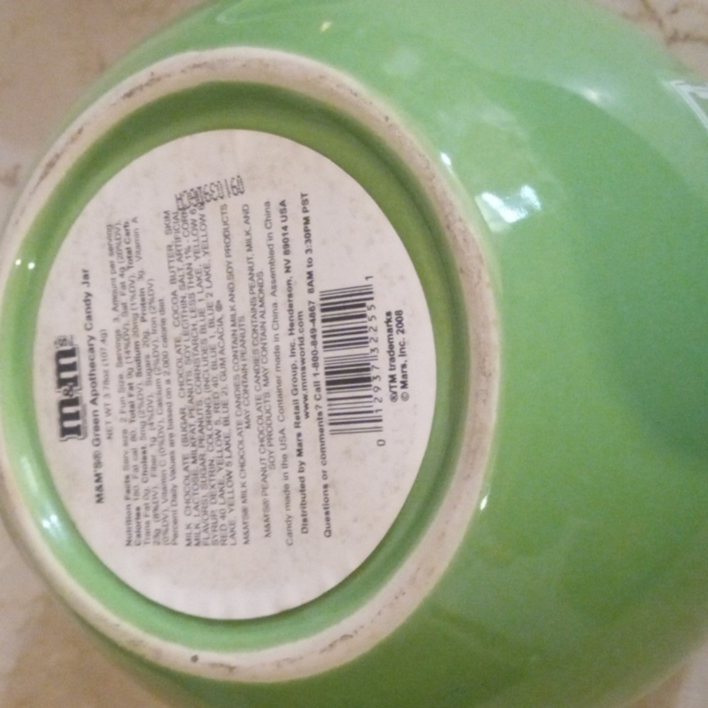 A M&M green canister. It can hold a variety of things. Cookies, Candy, Keys. - Picture 6 of 6